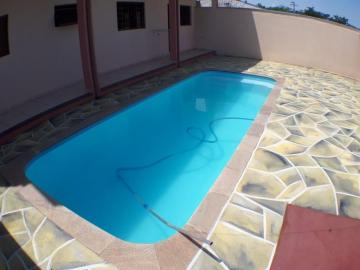 Sobrado junto com Barracão Comercial contendo 100m² e sobrado 144m², total de 244m² de área construída com piscina.